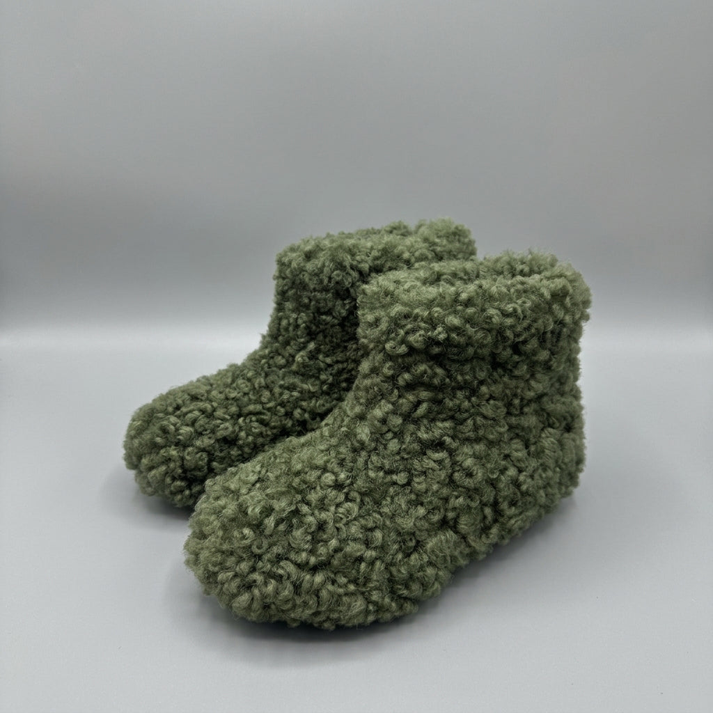 olive curly shearling ankle boots, three-quarter view of the pair