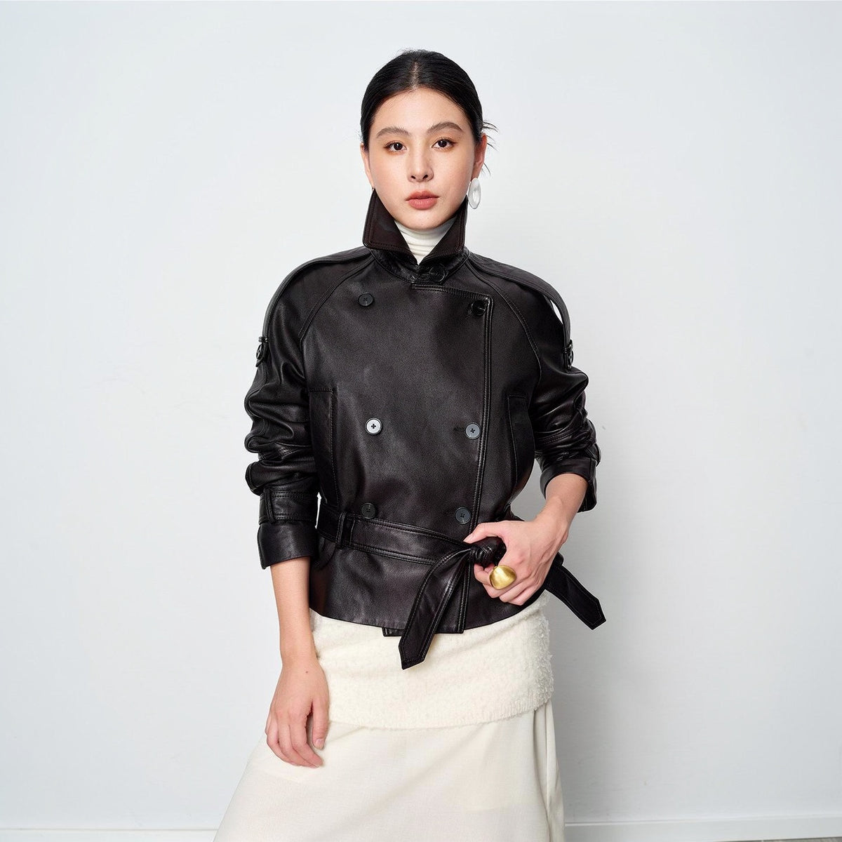 Vegetable-tanned sheepskin leather jacket in black, belted at the waist, front view