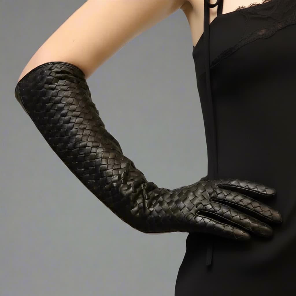 Long black leather gloves styled with wool coat and scarf for timeless elegance.