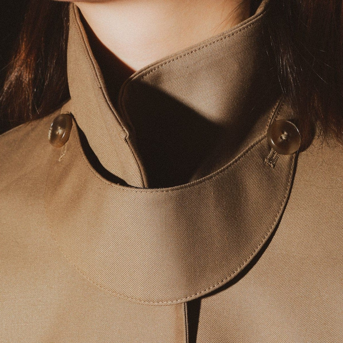 brown trench coat detail view