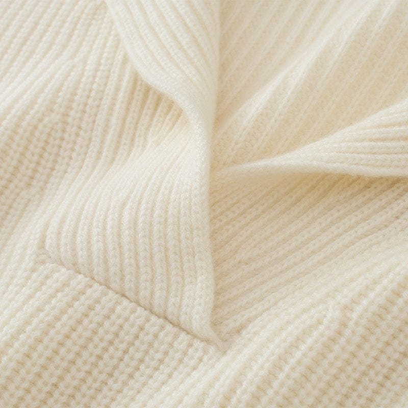 A closeup view of a white cashmere sweater at Haute Globetrot
