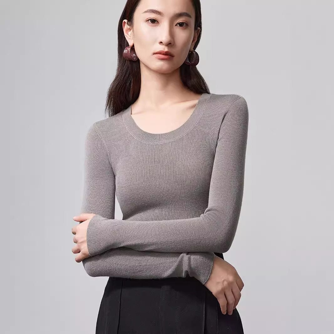 Crafted from mulberry silk + wool, this top keeps you warm without overheating.