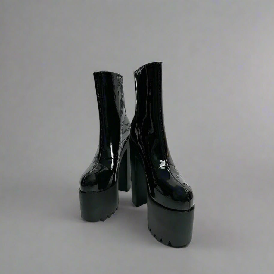 Super-high leather platform boots—elevate every outfit effortlessly.