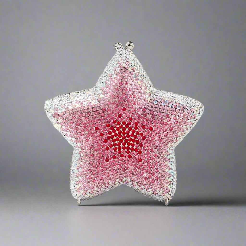 A celestial-inspired minaudière clutch with hand-set gradient Swarovski crystals.