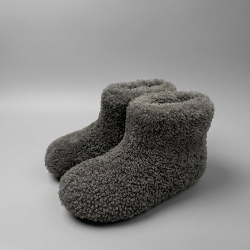 charcoal curly shearling ankle boots, three-quarter view of the pair