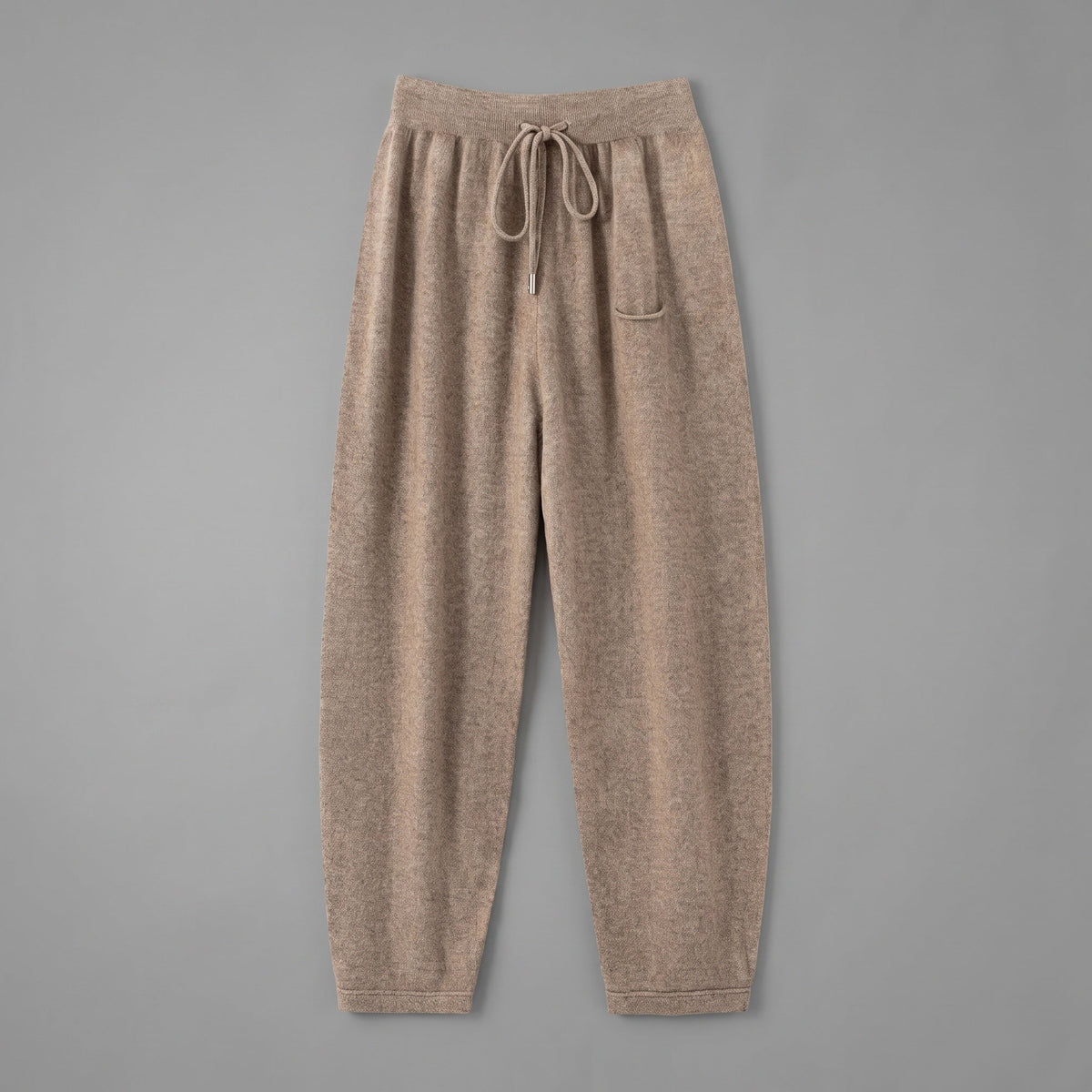 Cashmere joggers in brown, front view, on a grey studio backdrop