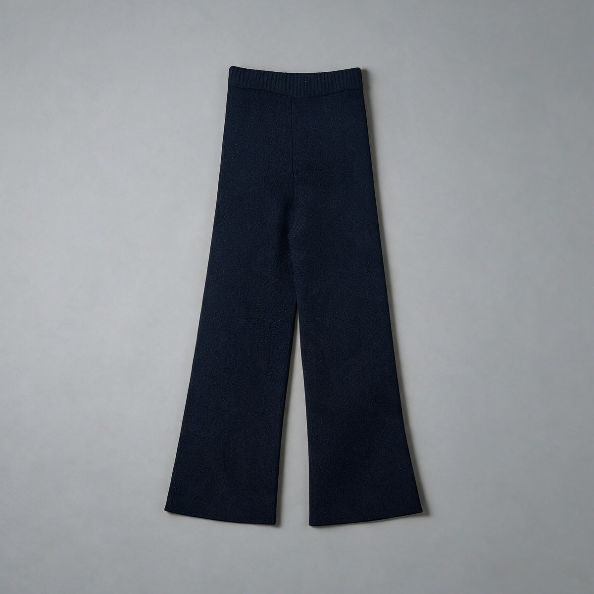 cashmere wool flared knit trousers in navy, front