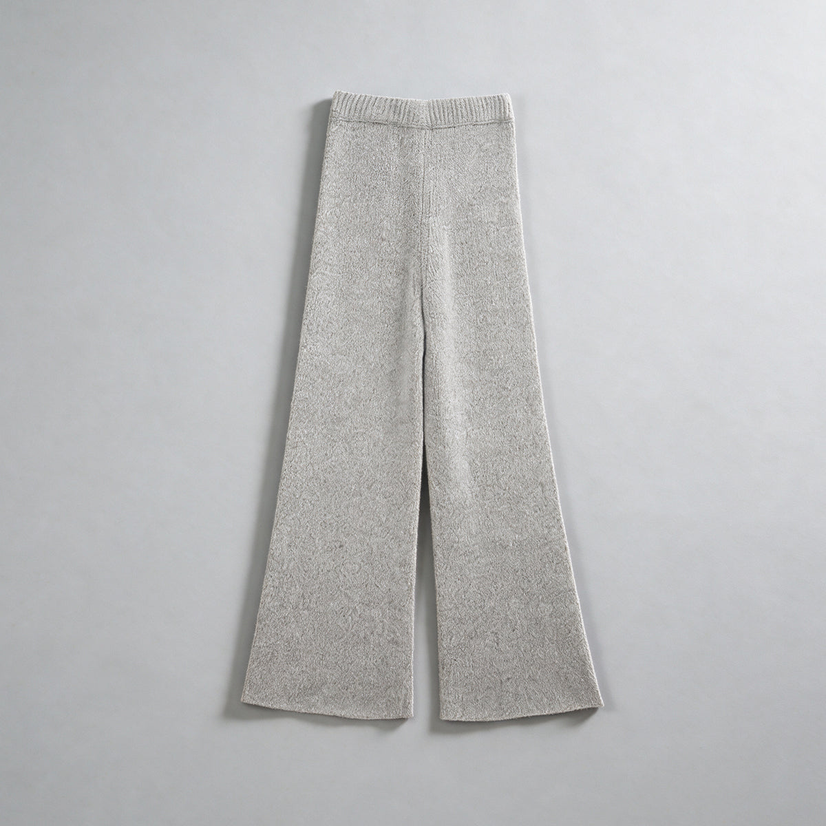 cashmere wool flared knit trousers in light grey, front