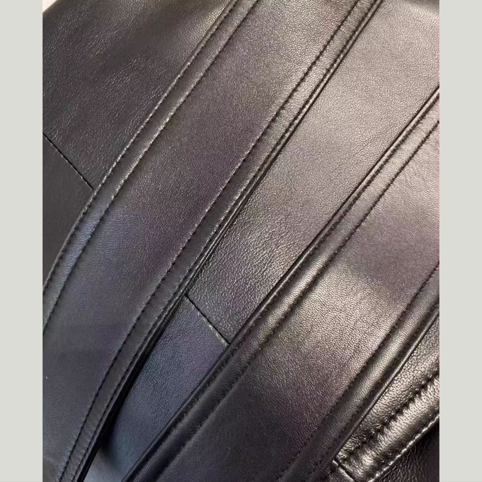 brown leather trench coat close up