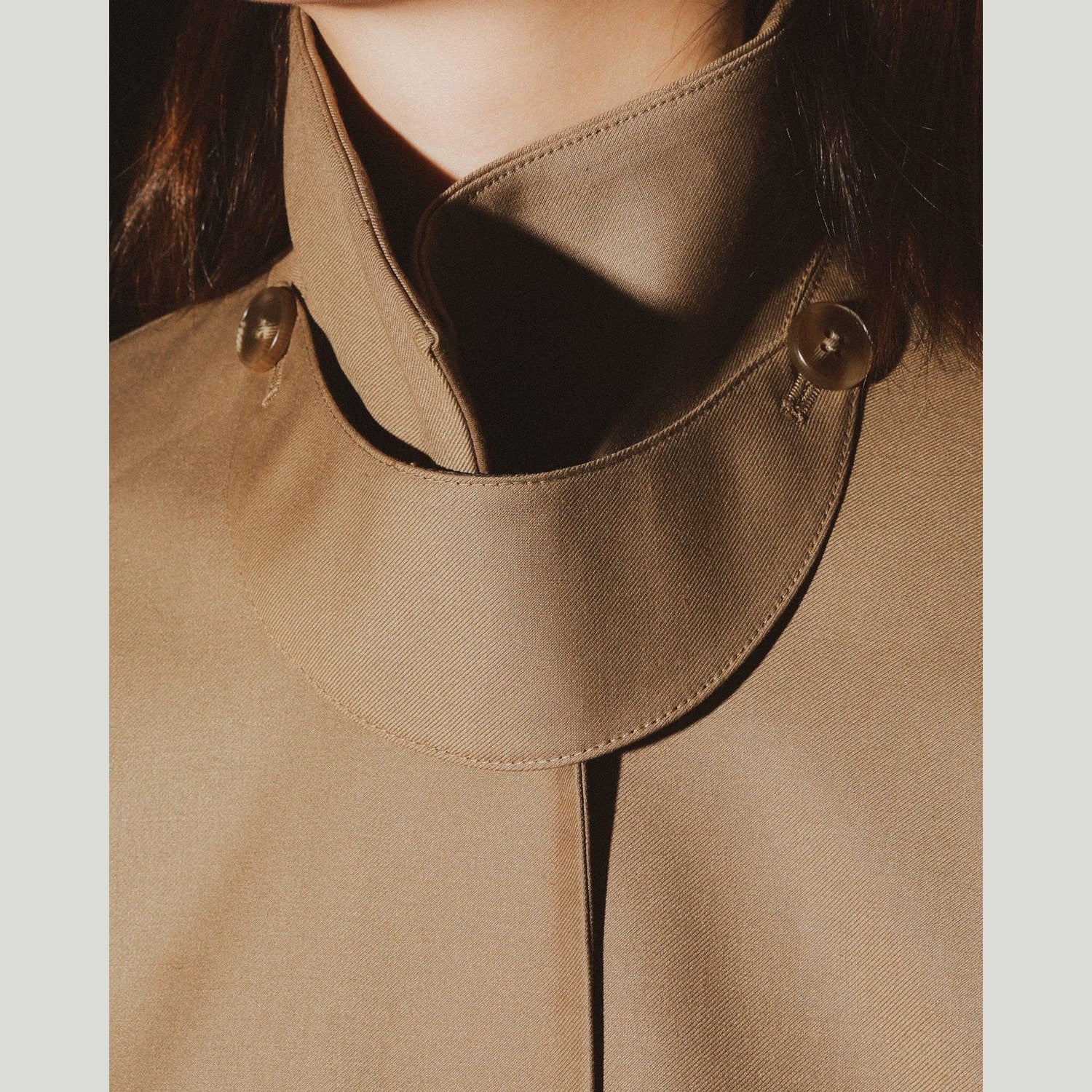 brown trench coat detail view