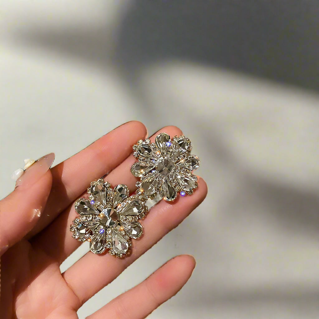 crystal earrings in hand