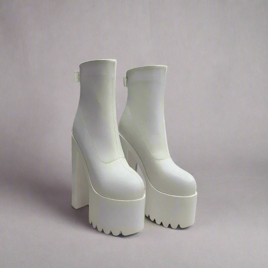 High-shine patent leather platform shoes for a striking, polished look.
