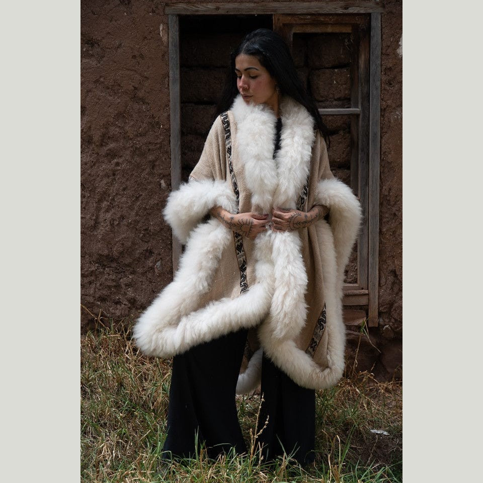 Elena Heritage Baby Alpaca Wool Cape draped elegantly over a cashmere sweater, embodying timeless quiet luxury.