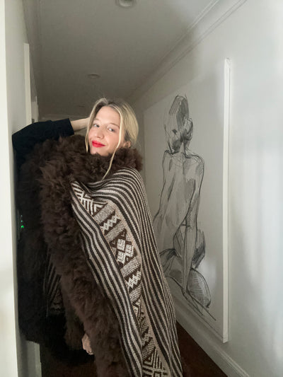 Video showcasing high quality basics under baby alpaca wool cape