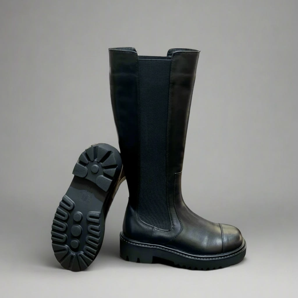 Tall black leather riding boots — detail