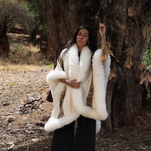 Handwoven baby alpaca wool cape by Peruvian women artisans using traditional techniques