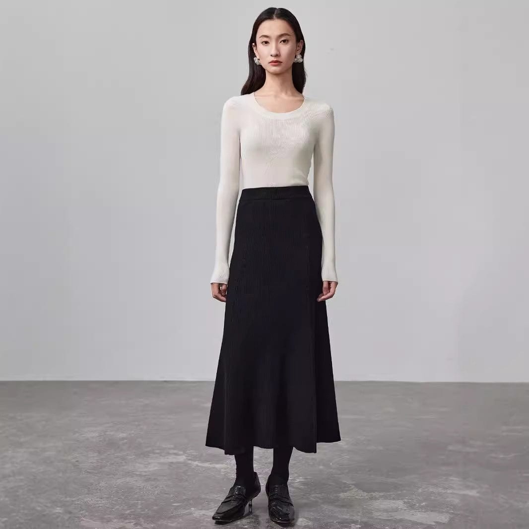 A sleek, temperature-regulating silk and wool top—designed for layering or wearing solo.