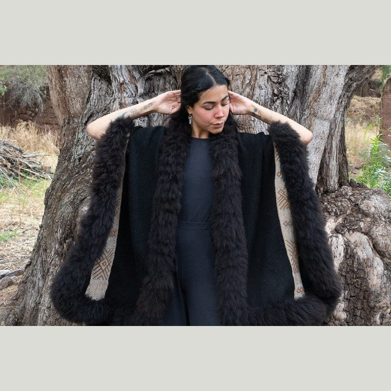 Detail shot of woven baby alpaca wool poncho cape from peru